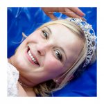 Bride-laughing-on-blue-bouncy-castle-.jpg